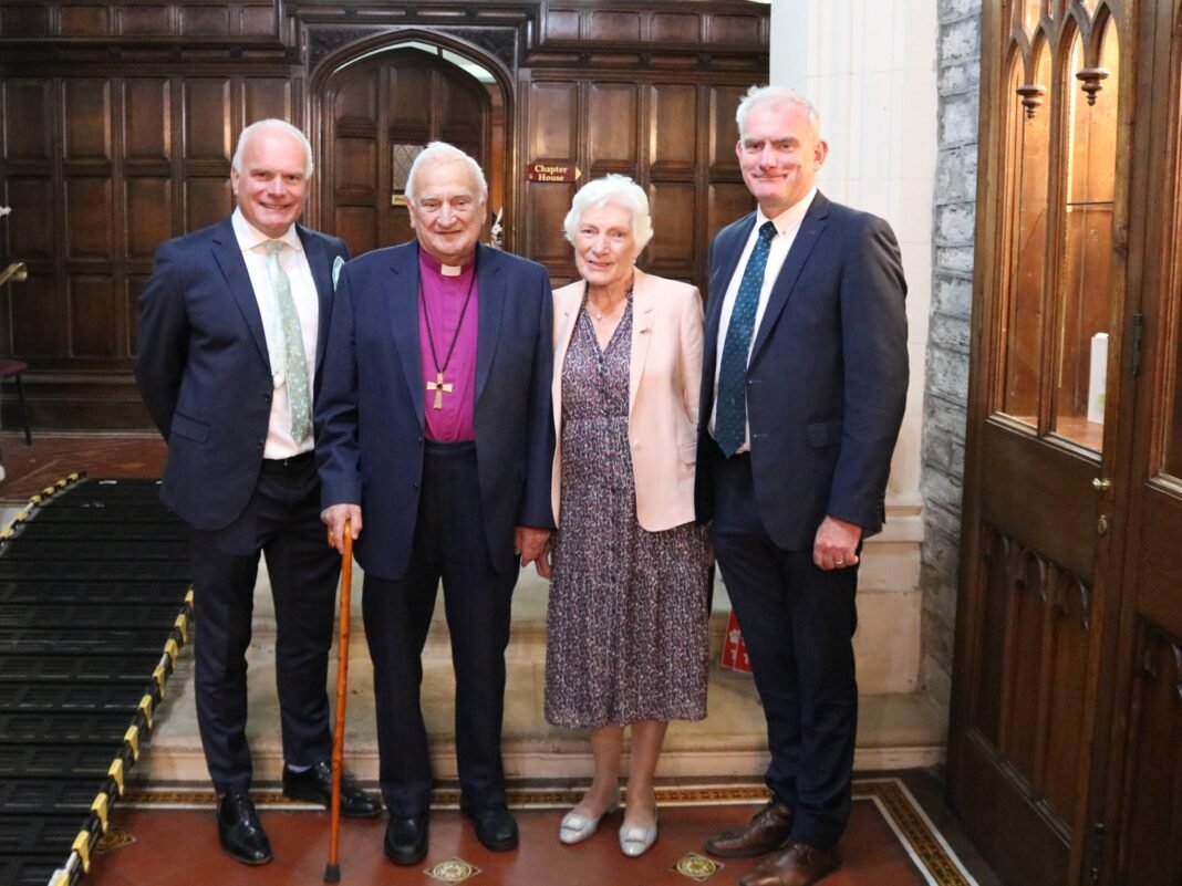 Lord Eames with Lady Eames and sons Niall and Michael - left and right respectively